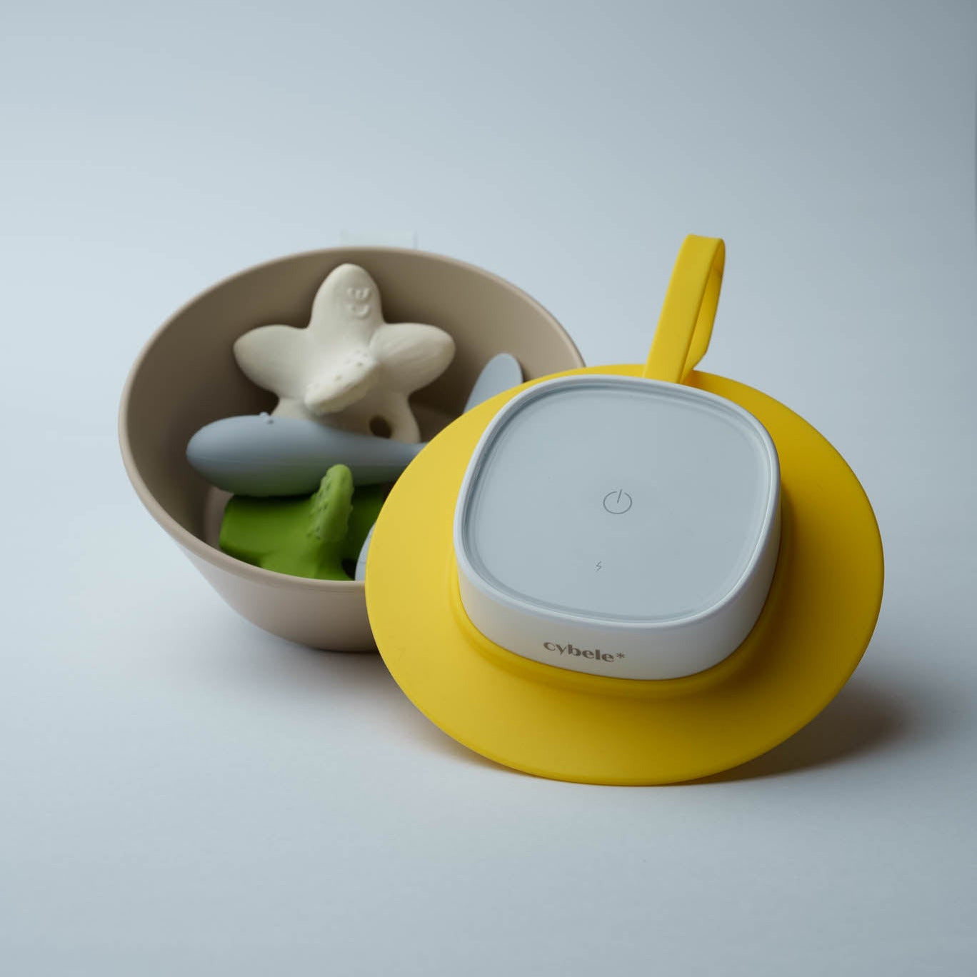 Lumen Portable UV Sterilizer connected to its extension pad, designed for effective cleaning and disinfection of baby spoons, teethers, pacifiers, bottle nipples, bowls, and other small baby accessories.