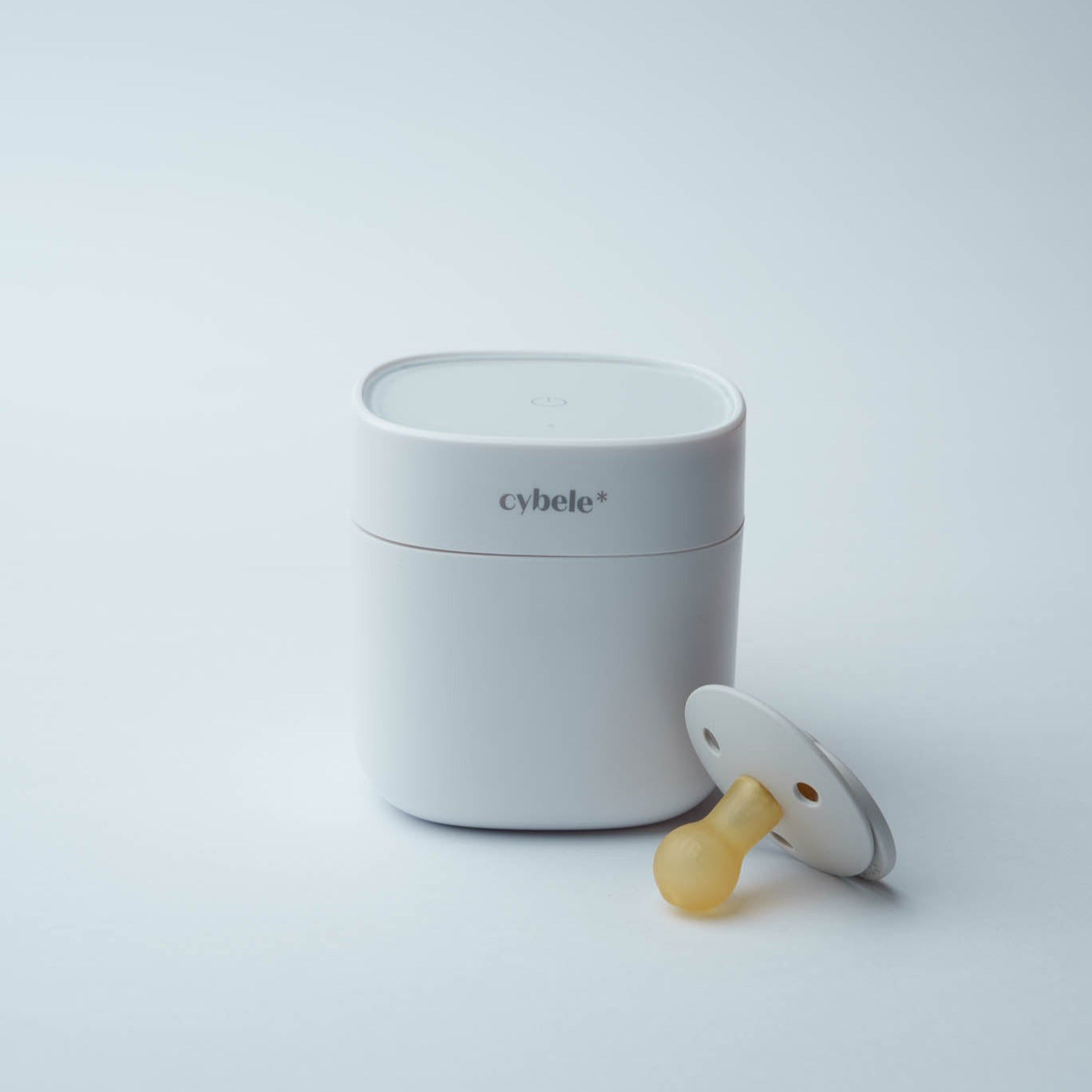 Lumen Portable UV Sterilizer: a compact sterilization box designed to disinfect one pacifier or small baby accessory at a time.