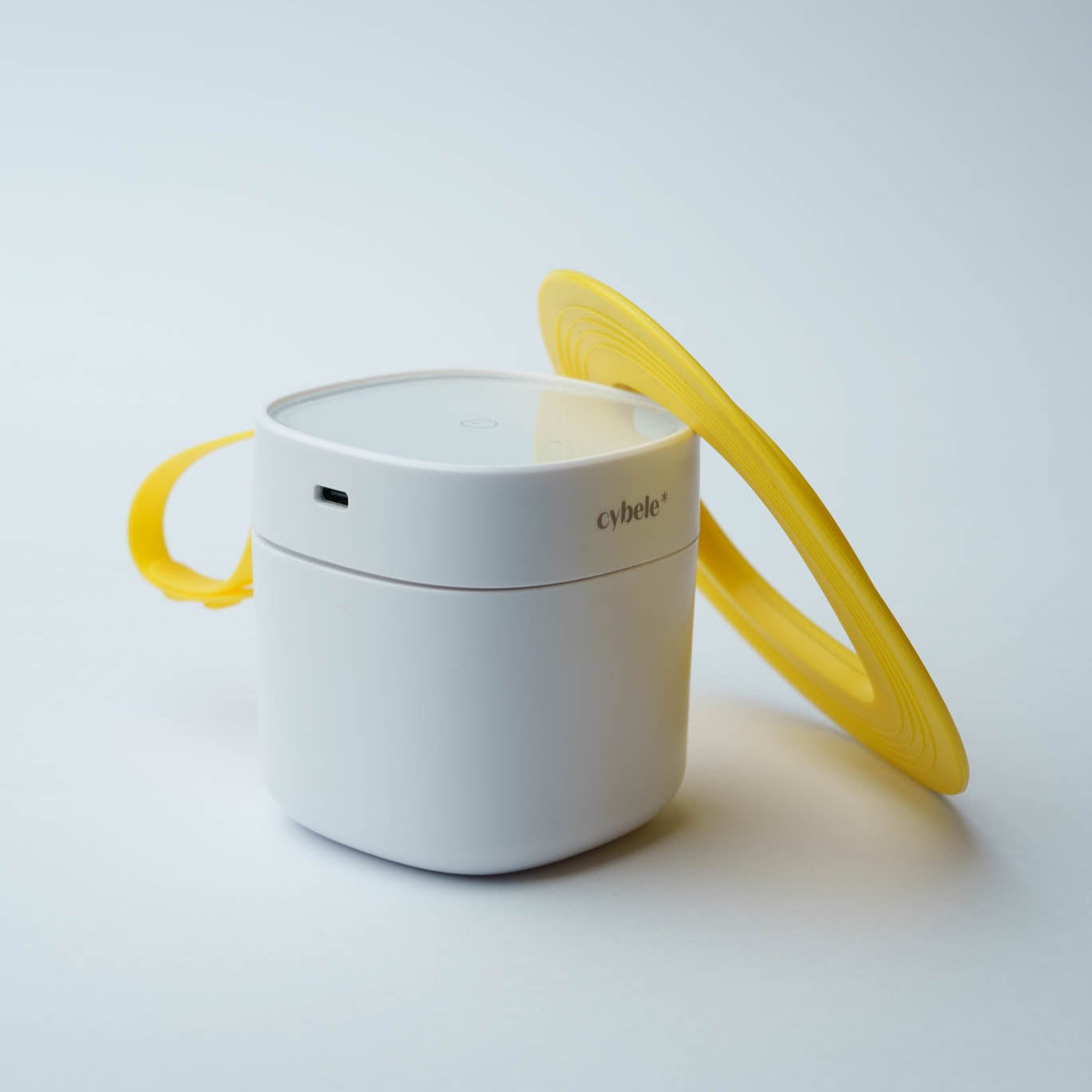 Lumen Portable UV Sterilizer connected to its extension pad, designed for effective disinfection of baby cuttlery, pacifiers, bottle nipples, bowls, and other baby accessories.