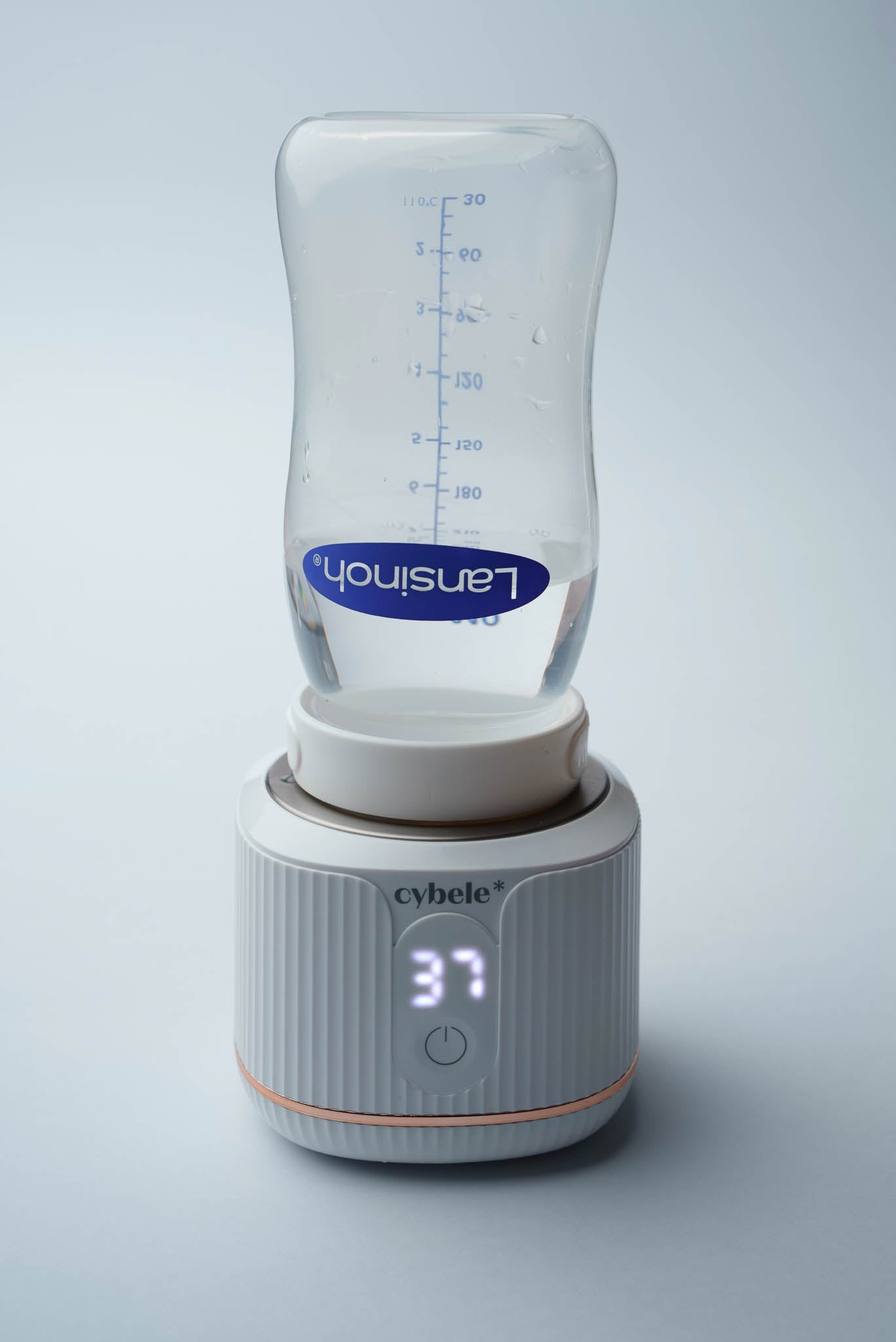 Stellar Portable Baby Bottle Warmer connected to a Lansinoh baby bottle via an adapter, warming breast milk, formula, or water.
