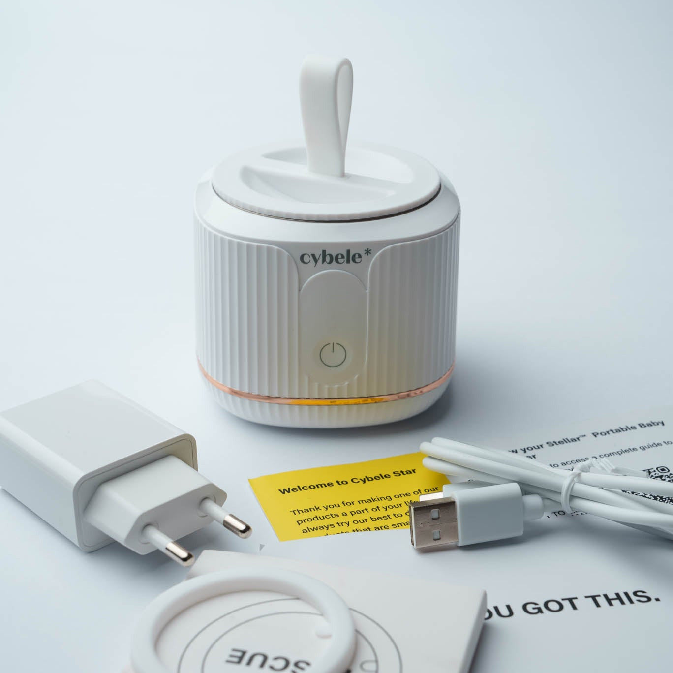 Stellar Portable Baby Bottle Warmer: The box includes Stellar™ Portable Bottle Warmer, screw-on dust cover, USB-C cable, power adapter, spare heating plate sealing ring and a QR code to the User Manual.