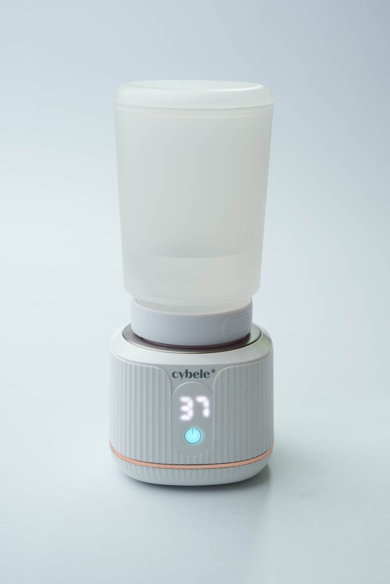 Stellar Portable Baby Bottle Warmer connected to a Suavinex Zero Zero baby bottle via an adapter, warming breast milk, formula, or water.